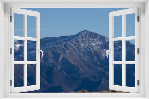 Fototapeta Naklejka Na Ścianę Okno 3D - The mountains and landscape above Lake Como during a winter day, near the town of Tremezzo, Italy - December 24, 2023.