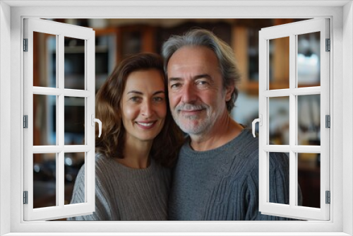 Happy middle-aged couple smiling with joy