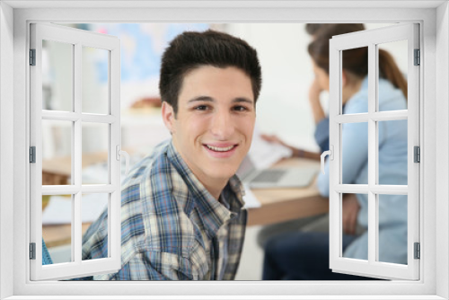 Portrait of college boy attending class