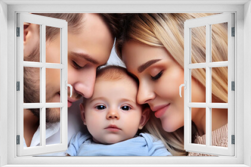 A serene portrait of parents with their happy, peaceful, and calm baby