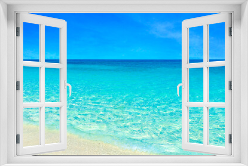 Fototapeta Naklejka Na Ścianę Okno 3D - Nature of the beach and sea Summer with sunshine, sandy beaches, clear blue waters sparkling against the blue sky. On an island with good ecology and environment Background for summer vacation