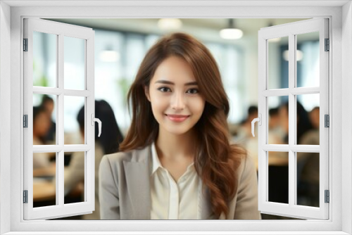 Portrait of a young Asian businesswoman smiling in an office