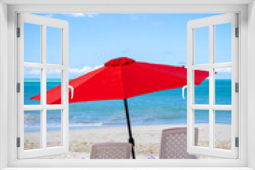 Fototapeta Naklejka Na Ścianę Okno 3D - Two empty beach chairs and an umbrella on a beautiful day in the Caribbean
