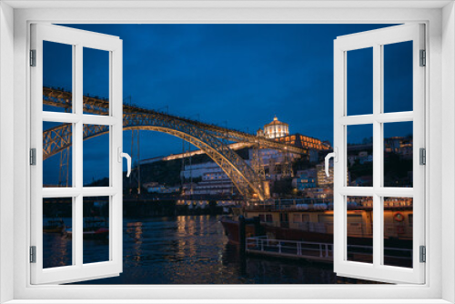 Fototapeta Naklejka Na Ścianę Okno 3D - Twilight view of the iconic Don Luis I bridge in Porto, Portugal over the Douro river