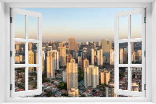 Fototapeta Naklejka Na Ścianę Okno 3D - Fotos aéreas da região do Brooklin em São Paulo. Zona Sul, ao amanhecer, e também o skyline dos prédios mais modernos.