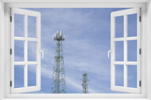 Fototapeta Naklejka Na Ścianę Okno 3D - Green cell phone tower with blue sky background