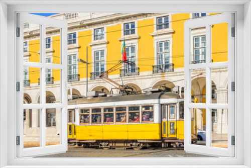 Fototapeta Naklejka Na Ścianę Okno 3D - Traditional yellow trams on a street in Lisbon, Portugal