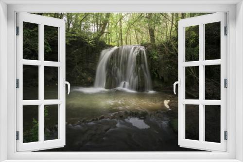 Fototapeta Naklejka Na Ścianę Okno 3D - Waterfall of Altube inside a beech forest in the province of Alava, in the Basque Country, on a spring morning