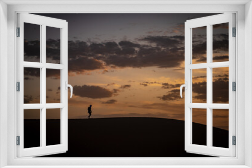 Fototapeta Naklejka Na Ścianę Okno 3D - silhouette of a person on a sunset Morocco