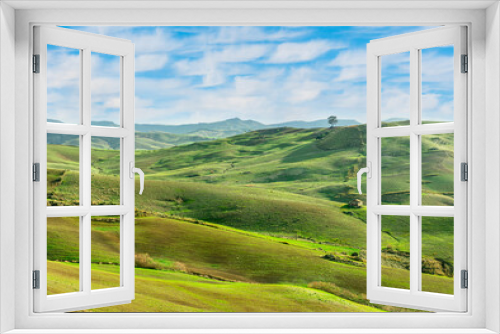 Fototapeta Naklejka Na Ścianę Okno 3D - beautiful rural view at summer or spring season fields and hills with rustic grassland and nice mountains with blue cloudy sky on background of countyside landscape
