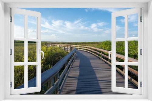 Fototapeta Naklejka Na Ścianę Okno 3D - Anhinga Trail elevated boardwalk over wetlands of Everglades National Park, Florida on sunny summer day..
