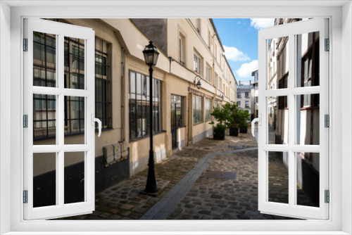 Fototapeta Naklejka Na Ścianę Okno 3D - vue du passage Saint Maur dans le 121ème arrondissement de Paris en France