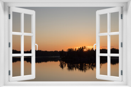 Fototapeta Naklejka Na Ścianę Okno 3D - island on a forest lake at sunset