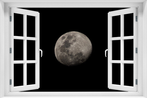 Fototapeta Naklejka Na Ścianę Okno 3D - The Nearly Full Moon On a Cloudless Night, with no Clouds Obscuring the Details