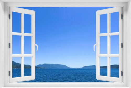 Fototapeta Naklejka Na Ścianę Okno 3D - 青い空と海と島々の背景素材