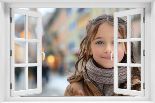 Cute young girl looks happily into the camera. Munich, Germany