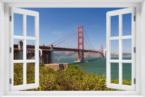 Fototapeta Naklejka Na Ścianę Okno 3D - the unique and world famous Golden Gate Bridge at a clear sky sunny morning in san francisco