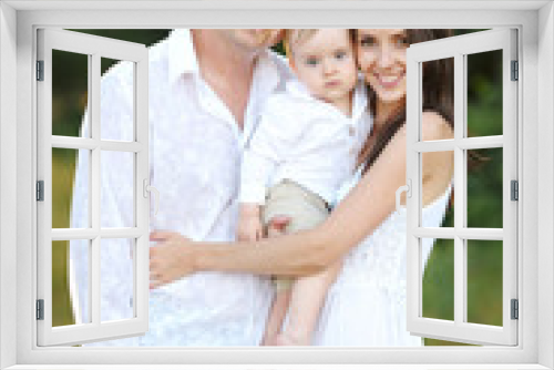 portrait of a happy family in summer nature