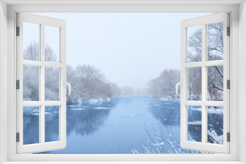 Fototapeta Naklejka Na Ścianę Okno 3D - Winter river in snowy weather