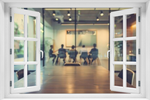 blurred office meeting room with business team working on project