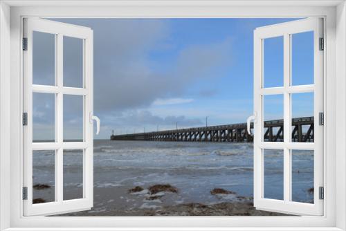 Fototapeta Naklejka Na Ścianę Okno 3D - long pier into sea on Belgian coast