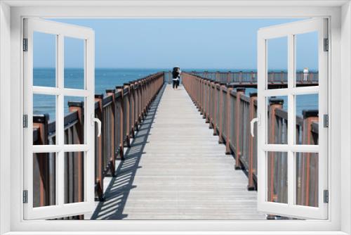 Fototapeta Naklejka Na Ścianę Okno 3D - View of the footbridge on the sea