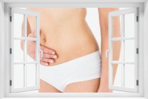 Fit woman suffering from stomach pain