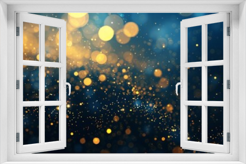 shimmering gold particles on a deep blue background with bokeh effect abstract wallpaper