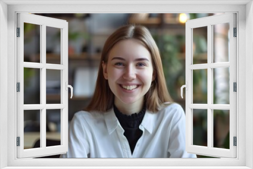 Cheerful Young Manager Enjoying Her Productive Workday in a Cozy Office