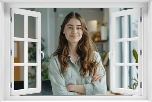 Portrait of confident young businesswoman in creative office.