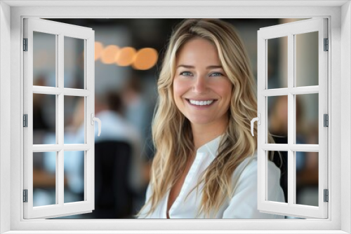 Professional Woman With Blonde Hair Smiling in Office