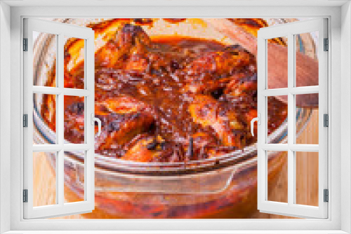 Fototapeta Naklejka Na Ścianę Okno 3D - Chicken wings in red tomato sauce