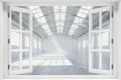 Industrial white warehouse with high ceilings and an empty floor plan, surrounded by a uniform white background