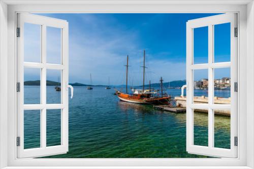 Fototapeta Naklejka Na Ścianę Okno 3D - A view from the marina at Sarande, Albania out to sea towards Corfu in the morning in summertime