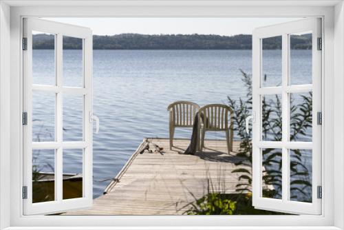 Fototapeta Naklejka Na Ścianę Okno 3D - 2 Stühle auf einem Holzdeck am See mit Angeln