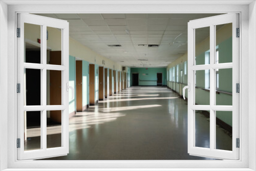 Shadows of the unseen: Traversing deserted hospital hallways where blurred shapes hint at the remnants of human activity now vanished, Generative AI