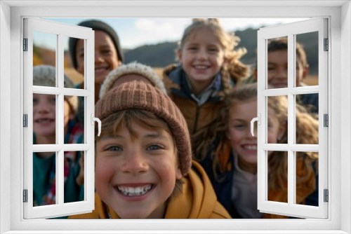 Portrait of a group of children smiling at camera in autumn park