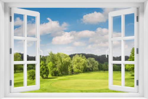 Fototapeta Naklejka Na Ścianę Okno 3D - Golf course landscape. Field with green grass, trees, blue sky