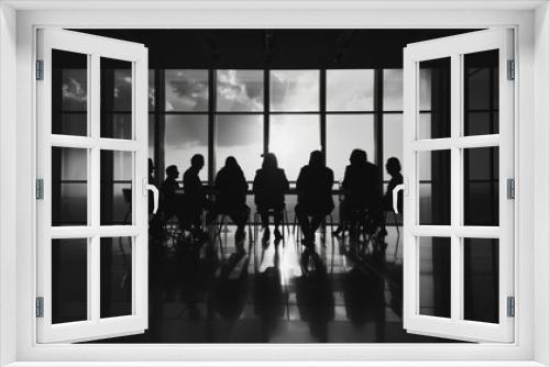 Silhouetted business meeting in white and black