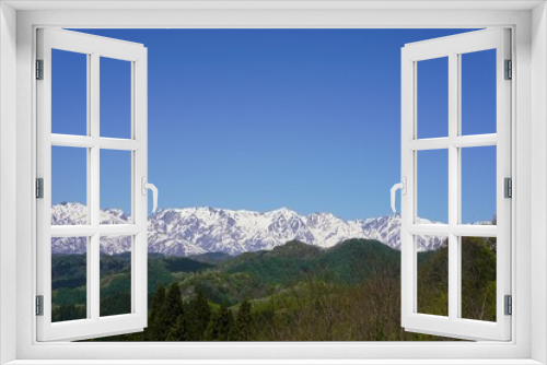 Fototapeta Naklejka Na Ścianę Okno 3D - 小川村の景色　残雪の白馬三山と新緑の里山