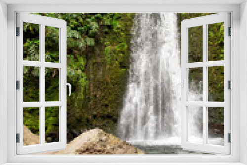 Fototapeta Naklejka Na Ścianę Okno 3D - Waterfall Salto do Prego on the Isle of São Miguel, Azores, Portugal. Waterfall with tropical green vegetation and forests. Travel destination. Hiking on Azores Island.