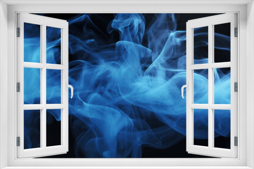 A close-up view of blue smoke on a dark background, ideal for use in abstract art or atmospheric scene concepts