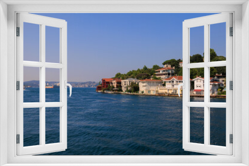 Blue seascape overlooking the coast. View of the Bosphorus in Istanbul city on sunny summer day, in a public place.