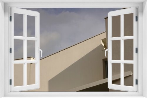 Fototapeta Naklejka Na Ścianę Okno 3D - geometric white facade against blue sky