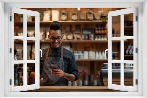 The barista with mobile phone