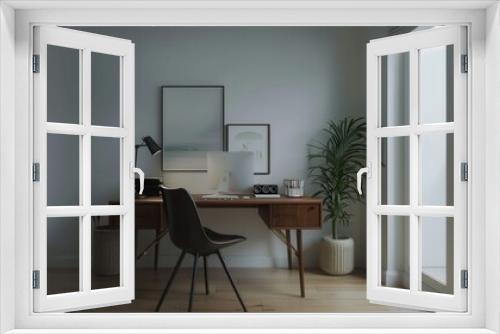 A sleek, modern home office features a wooden desk with a computer, lamp, and chair, with a minimalist aesthetic and natural light.