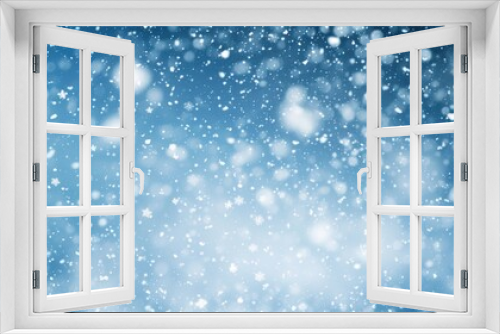 Snowy night scene with a blue background, snowflakes, and stars