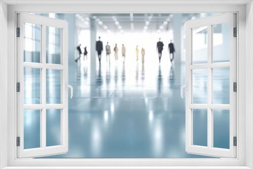 Business people walking in modern office corridor with bright sunlight. Abstract view of busy corporate workspace and teamwork environment.