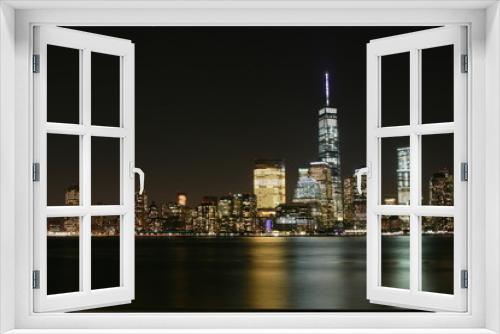 Fototapeta Naklejka Na Ścianę Okno 3D - Manhattan night  view with skyscrapers on the right