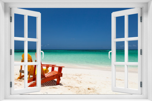 Fototapeta Naklejka Na Ścianę Okno 3D - Colorful lounge chairs at Caribbean beach